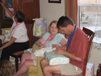 03-Chris_and_Kristi_opening_presents_for_Kenny