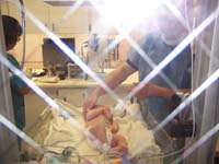 30-Chris_getting_ready_to_hold_Kenny_in_nursery