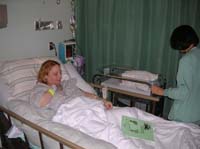 42-Kenny_getting_wheeled_into_room_with_Kristi-1730