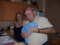 01-Tom_getting_Kenny_ready_for_his_first_bath