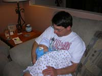 14-Chris_holding_bundled_Kenny_after_bath