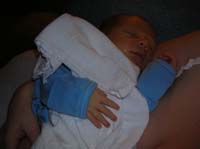 04-close-up_of_Kenny_sleeping_in_Kristi's_arms