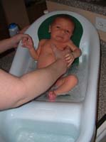05-first_real_bath_since_umbilical_stump_finally_fell_off