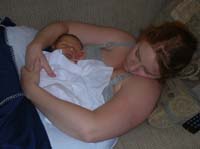 01-Kenny_and_Kristi_taking_a_nap_on_couch