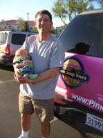 11-Chris_holding_Kenny_in_front_of_Pink_Suburban