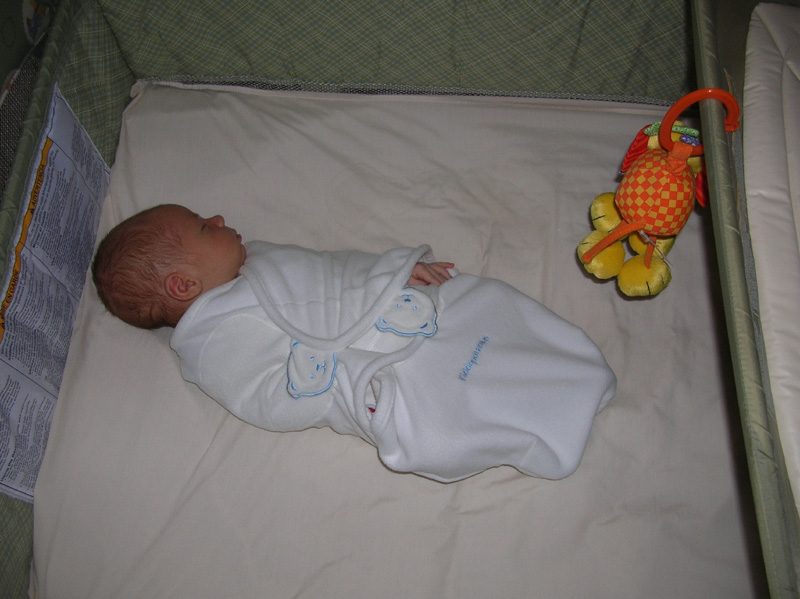 01-Kenny_wrapped_up_sleeping_in_crib