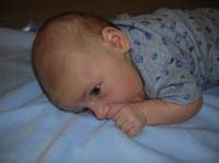 21-Kenny_on_his_stomach_sucking_on_his_fist