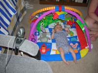 39-Kenny_playing_in_Baby_Einstein_while_Chris'_parents_watch_over_webcam