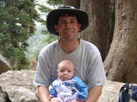 07-Chris_holding_Kenny_in_pine_forest