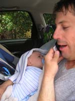 16-Chris_holding_Kenny_closely_talking_to_Mom_after_running_in_rain_and_hail_back_to_car