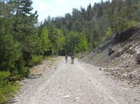 43-Chris_carrying_Kenny_on_trail_with_Toby_in_tow