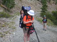 52-Amy_carrying_happy_Sierra_with_Toby_lagging_behind
