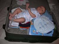 03-Kenny_in_suitcase_ready_to_visit_grandma