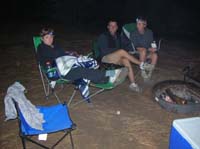 021-Kristi-Baxter-Chris_R_and_Beth_hanging_out_by_the_fire