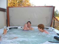 34-Kenny_enjoying_the_hot_tub_with_Mommy_and_Daddy