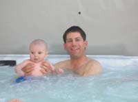 35-Kenny_enjoying_the_hot_tub_with_Daddy