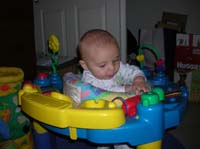 01-Kenny_playing_with_his_old_exersaucer