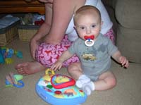 46-Kenny_sitting_up_and_playing_with_toy