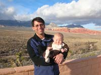 13-Daddy_holding_Kenny_who_is_not_happy_looking_into_the_sun