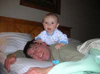 003-playing_with_Daddy_on_the_hotel_room_bed