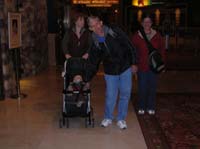 30-Kenny_holding_Grandpa's_finger_while_walking_through_Treasure_Island