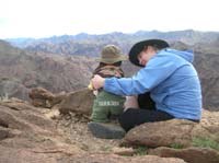 43-Kenny_checking_out_the_volcanic_rock