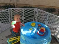 28-Kenny_playing_with_his_water_table