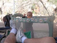 01-Kenny_playing_in_his_crib_at_Zion_NP