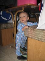 05-Kenny_playing_under_the_table_in_the_camper-maybe_not_next_time
