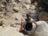 48-Danah_climbing_down_a_boulder