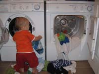 25-moving_washed_clothes_into_the_dryer