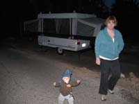 12-Kenny_and_Mommy_with_our_camper_in_background