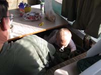 21-next_morning-Kenny_climbing_onto_couch_from_floor