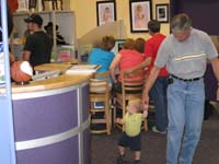 08-Kenny_going_for_a_walk_with_Grandpa_while_the_ladies_pick_out_the_pictures