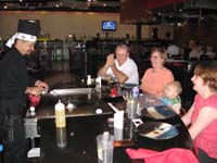 46-Kenny_and_family_being_entertained_at_Japanese_Steak_House