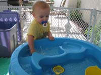 09-Kenny_playing_with_his_water_table