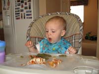 06-Kenny_eating_pizza_and_green_beans