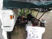 024-Daddy_watches_Gary_fix_the_regulator_so_our_propane_will_work-$180_later