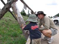 059-Kenny_really_enjoyed_playing_by_this_fence-cried_when_we_took_him_away
