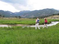 090-Mommy_Amy_and_Kenny_walking_through_tall_grass