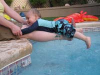 20-Mommy_has_Kenny_on_her_leg_while_putting_him_in_the_water