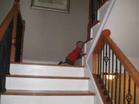 03-climbing_down_the_stairs_at_Grammy_and_Grampa_Duke's_house