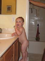 008-naked_boy_cleans_his_teeth