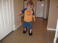 009-Kenny_successfully_walks_in_Mommy's_shoes