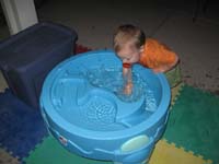 031-Kenny_splashes_in_the_water_table