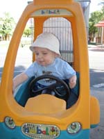 047-Kenny_in_the_cool_car_like_stroller