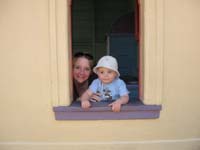 049-Kenny_and_Mommy_in_a_play_house_window