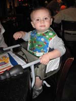 054-dinner_at_Geisha_House-Kenny_sitting_in_hook_on_highchair
