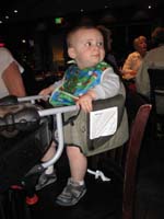 056--Kenny_sitting_in_hook_on_highchair