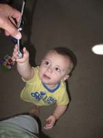 066-Kenny_really_wants_the_cell_phone_to_talk_with_Baba